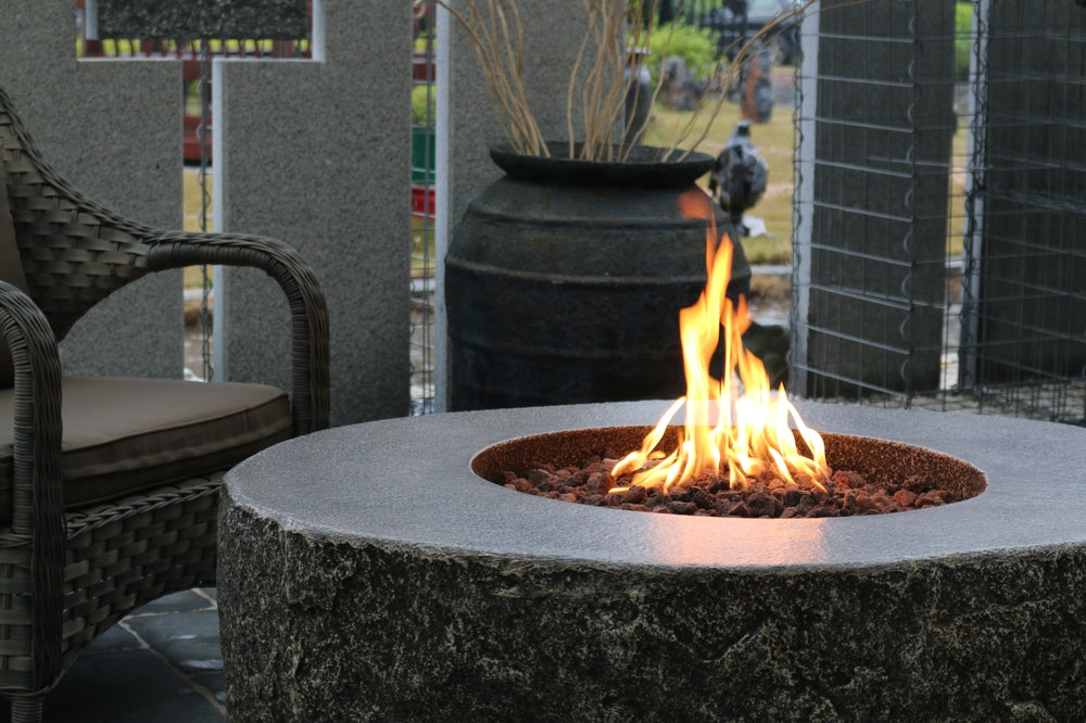 Circular stone firepit table with flames, 50 inches, outdoor patio setting