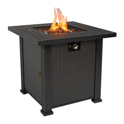 Black square steel fire pit table with wicker-style finish, lit flames, volcanic stones, and control knob