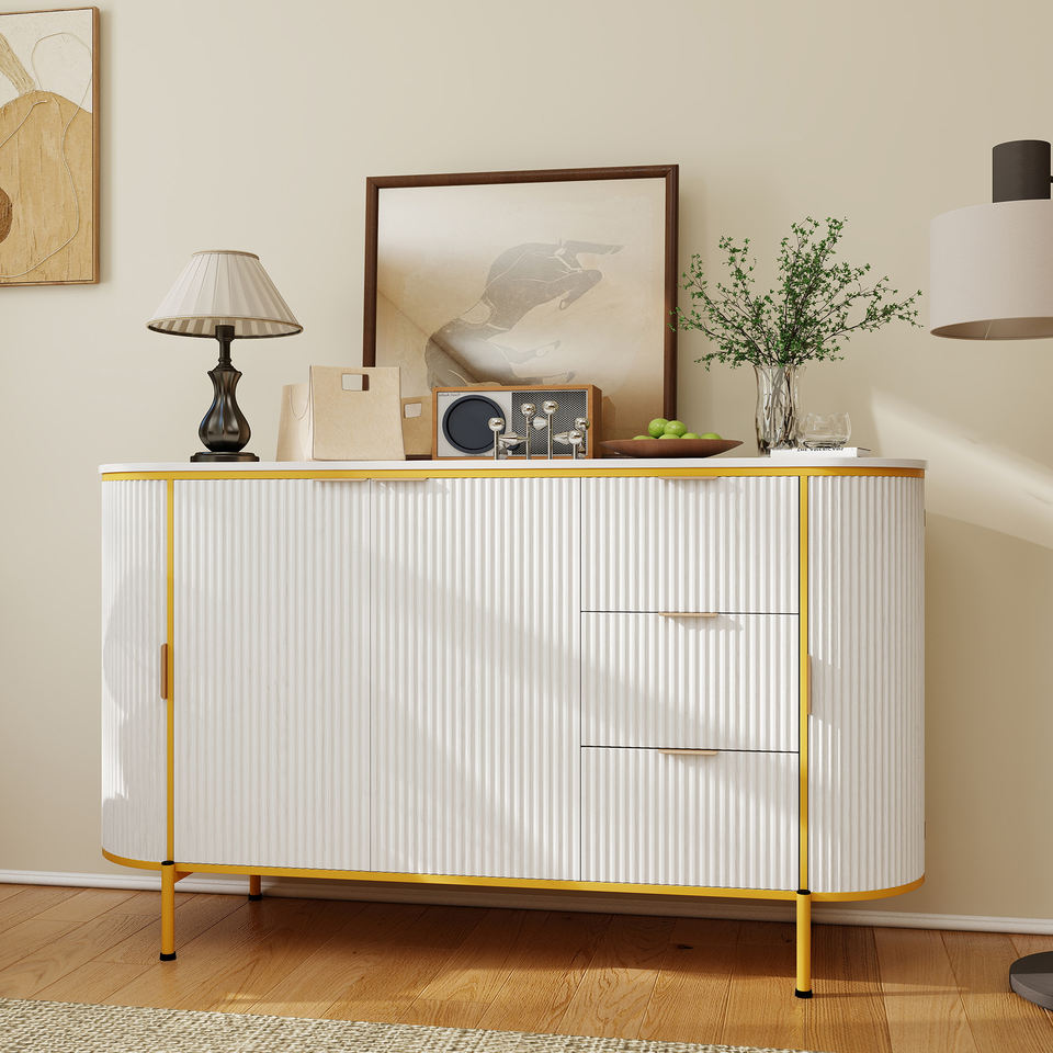 Curved solid wood storage cabinet with gold trim, fluted doors and multiple drawers