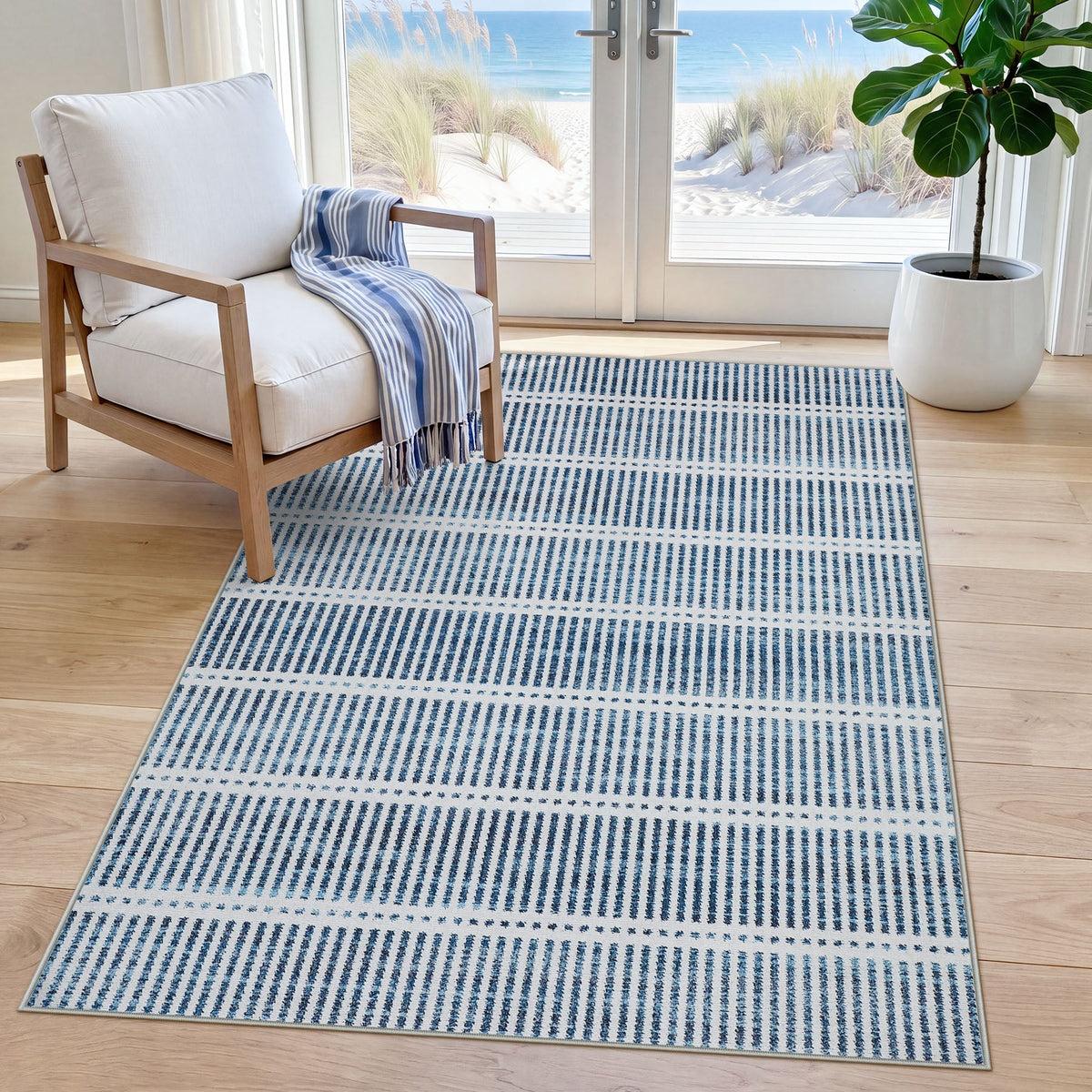Blue and white striped area rug on light wood floor near chair and window