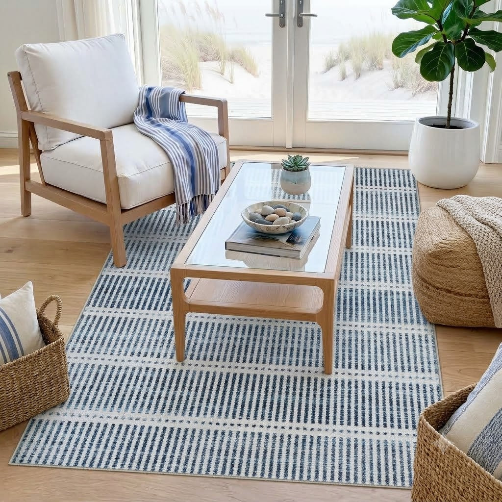 Blue and white striped area rug on light wood floor in a living room with furniture