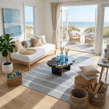 Blue and white striped area rug on light wood floor in coastal living room