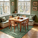 Green abstract wood grain area rug on hardwood floor in dining nook