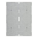 Black and white geometric patterned area rug, flat lay view
