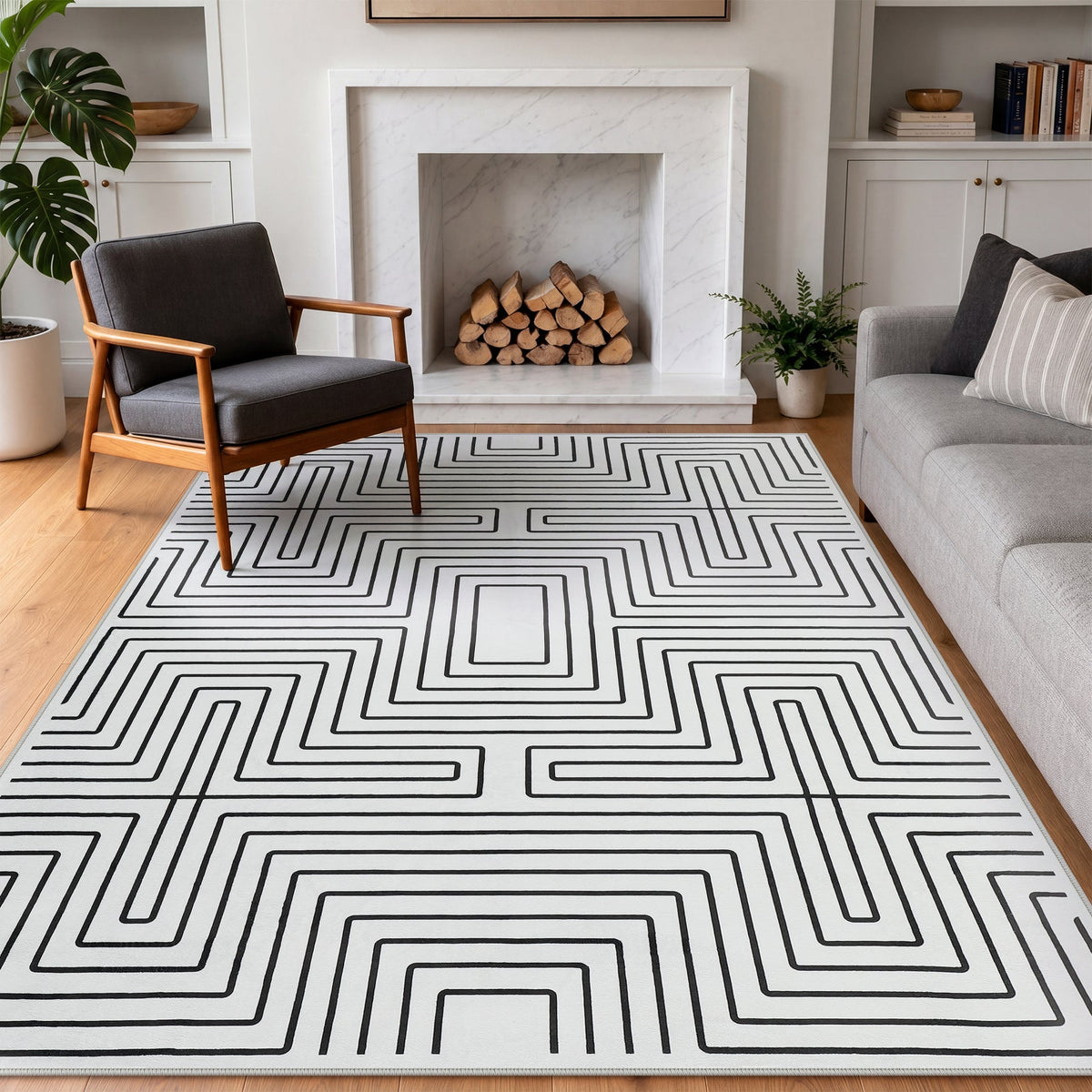 Black and white geometric patterned area rug on hardwood floor in modern living room