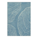 Blue area rug with white leaf vein pattern, shown flat on floor