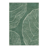 Green area rug with white leaf vein pattern, shown flat on floor