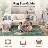 Green leaf pattern rug in living room with family, 152cm x 213cm size guide shown