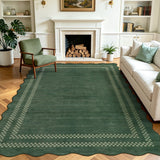 Scalloped dark green area rug with light green checkered border on wooden floor in living room with sofa and chair