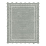 Scalloped gray area rug with white checkered border, viewed from above