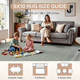 Grey scalloped geometric rug in living room with woman and children playing, 8x10 size guide shown