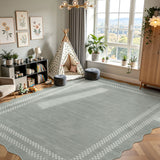 Scalloped grey area rug with white geometric border in a sunlit child's room