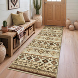 Southwestern patterned runner rug in beige and brown on light wood floor near wooden door