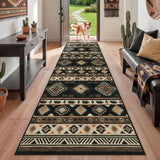 Black and beige southwestern patterned runner rug on hardwood floor in hallway with dog at doorway