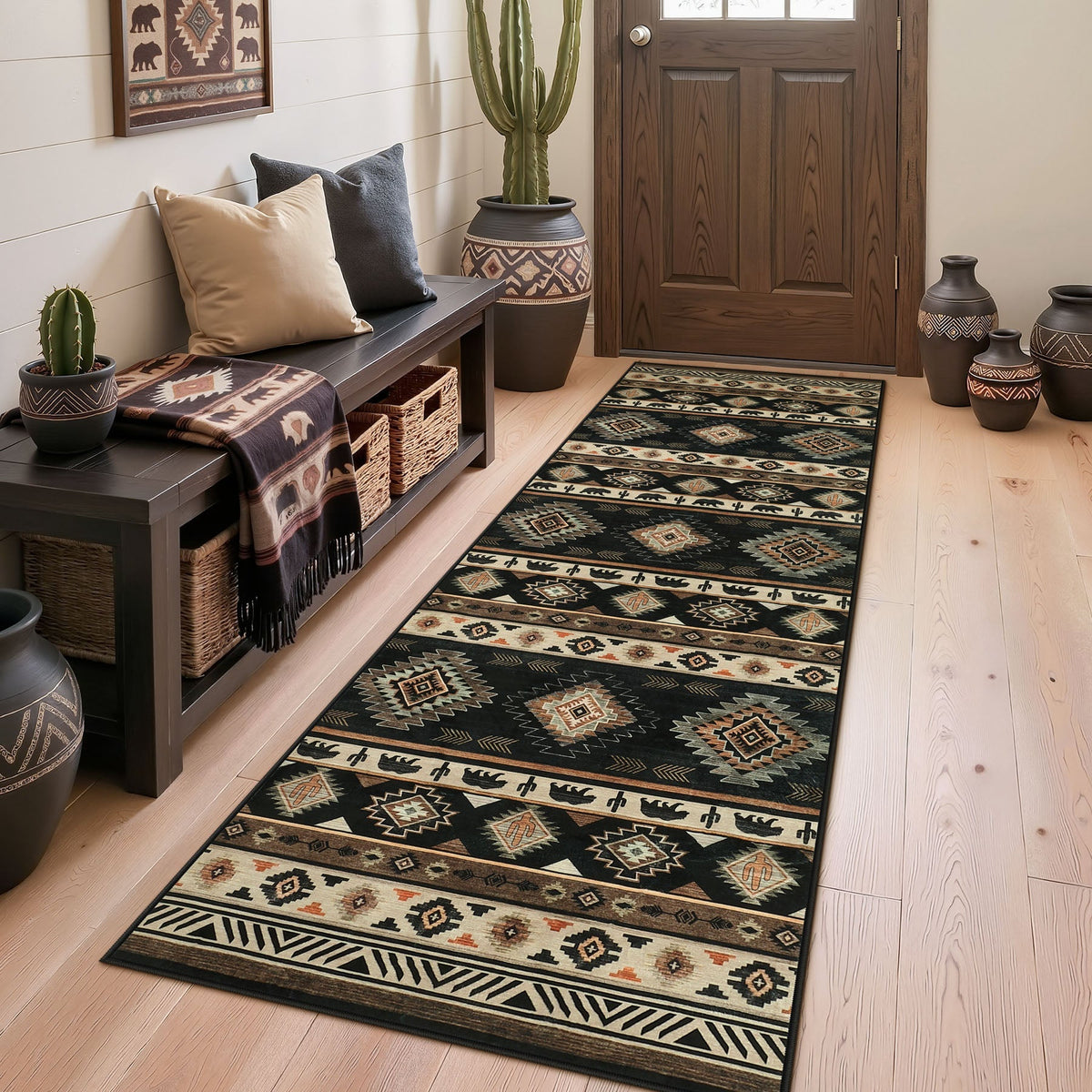 Black and beige southwestern patterned runner rug on light wood floor near door and bench