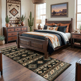 Southwestern patterned runner rug in black, beige, and brown on hardwood floor in bedroom