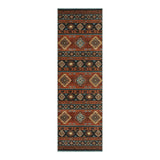 Southwestern patterned runner rug in earth tones, shown flat on floor