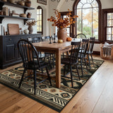 Southwestern patterned area rug in beige, black, and orange on hardwood floor in dining room