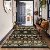 Southwestern patterned rug in beige, black, and brown on wooden floor near open door