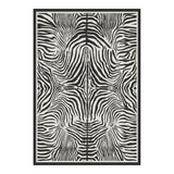 Black and white zebra print area rug with border, shown flat on floor