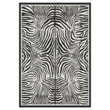 Black and white zebra print area rug with non-slip backing, shown flat