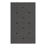 Black and beige geometric patterned jute area rug, flat lay view