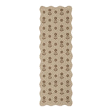 Beige jute runner rug with brown floral pattern, shown flat on floor