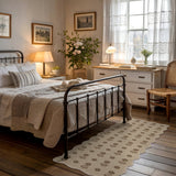 Beige floral jute runner rug on wooden floor in bedroom