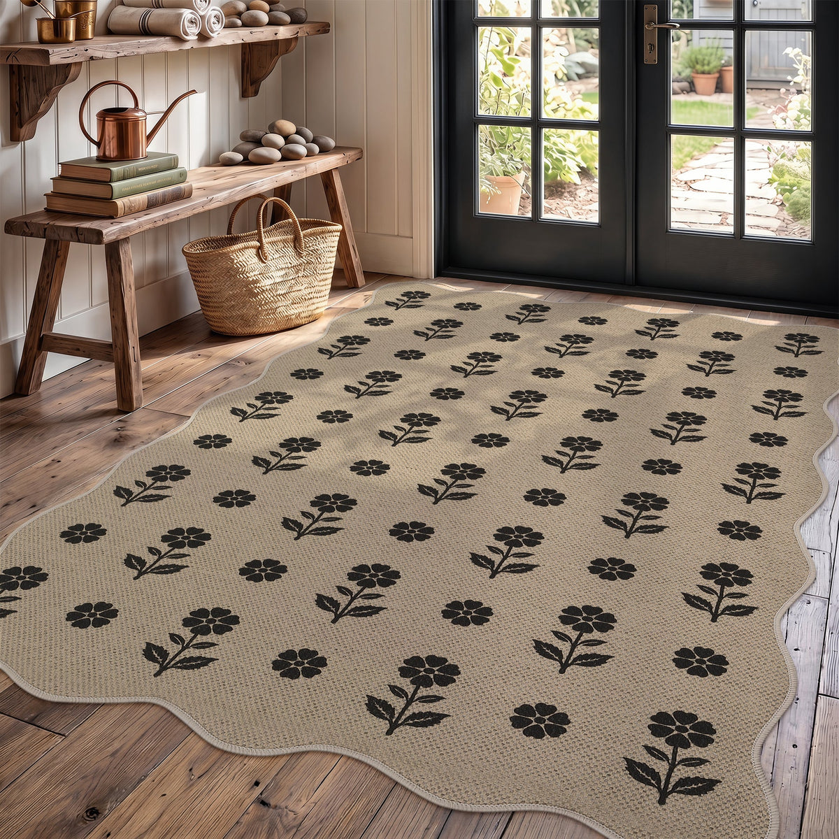 Beige jute rug with black floral pattern on wooden floor near glass door