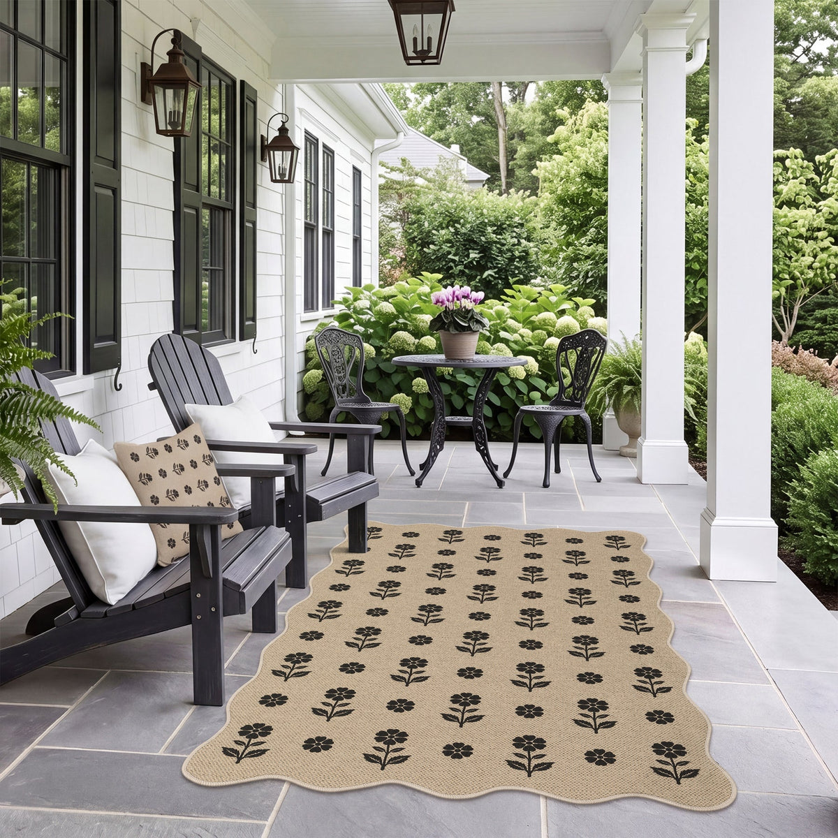 Black floral pattern on beige jute rug on stone patio under porch
