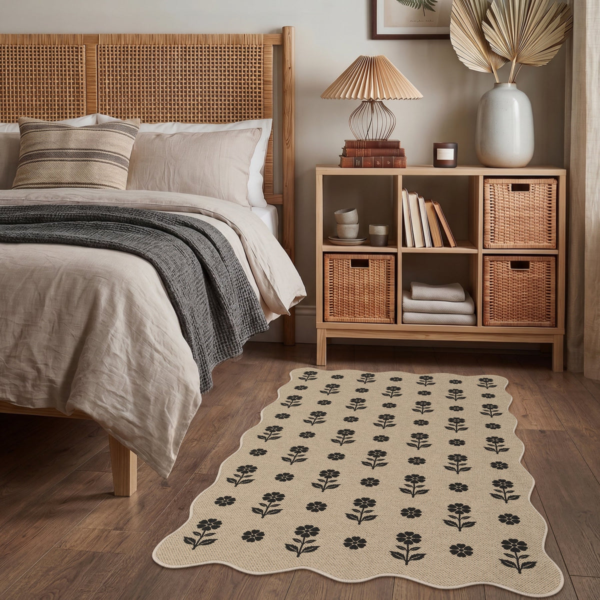 Black floral pattern on beige jute rug on wooden floor in bedroom