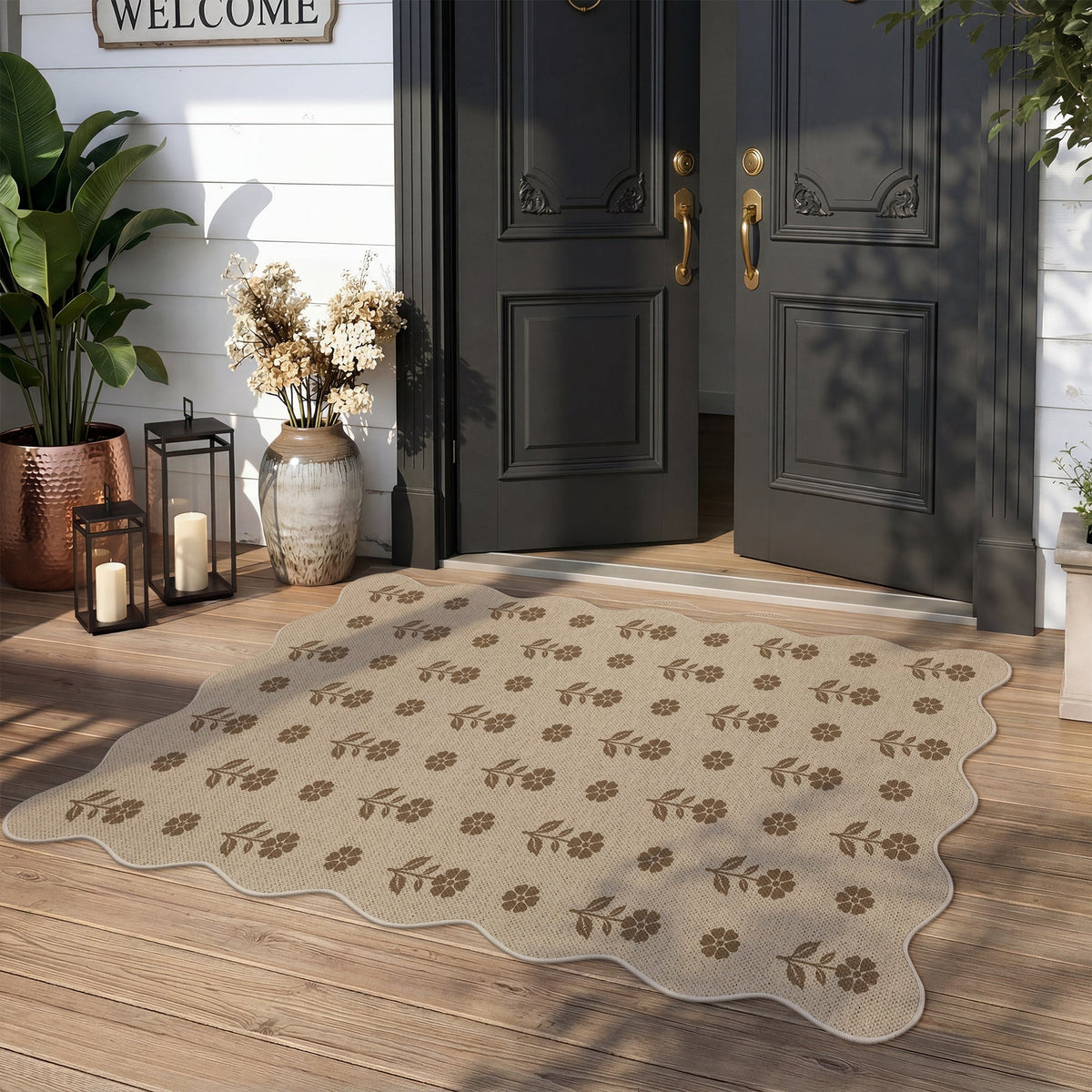Beige floral patterned jute rug on wooden porch in front of black doors