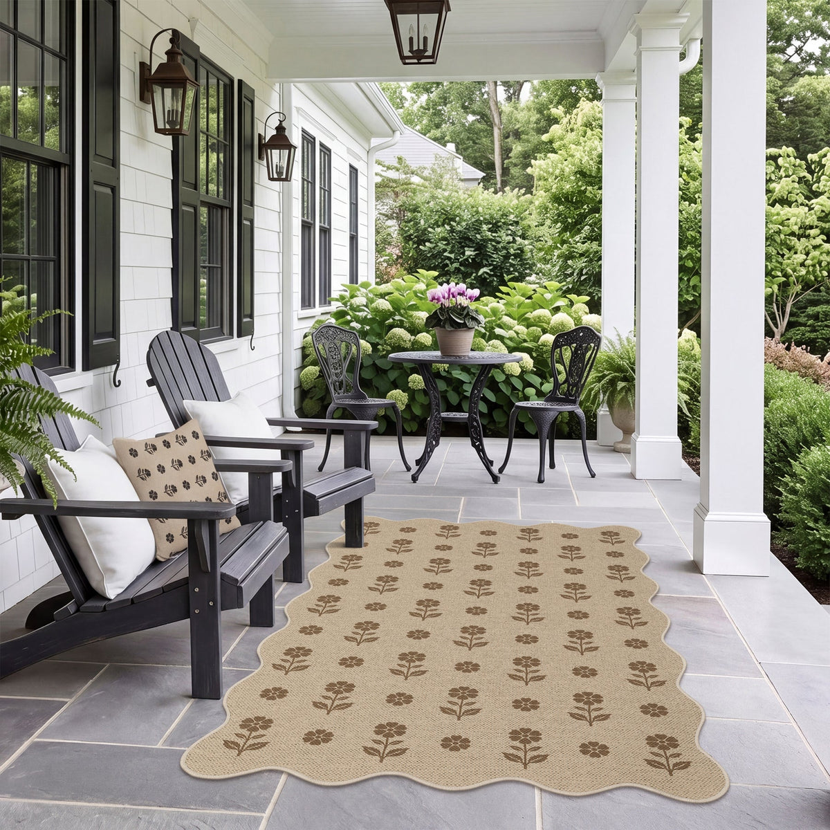 Beige floral patterned jute rug on stone patio with outdoor furniture