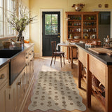 Beige floral jute rug on wooden floor in kitchen with cabinets and table