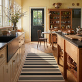 Black and beige striped jute runner rug on wooden floor in kitchen