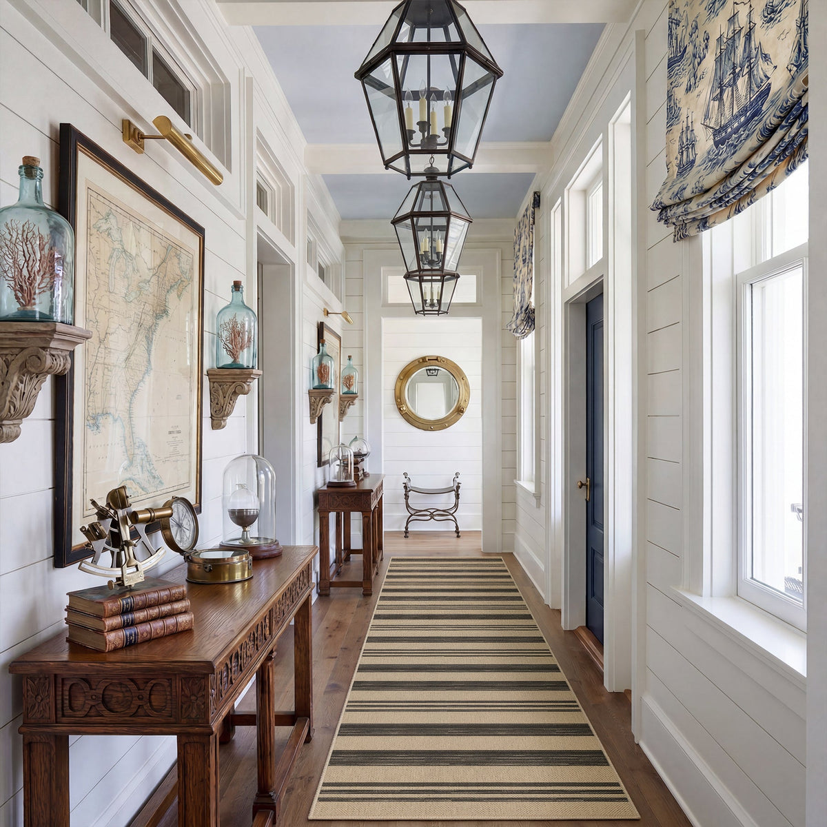 Striped jute runner rug in beige and dark brown, shown in a hallway with wooden floors and white walls