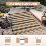 Striped beige and brown jute rug, 36 x 60 inches, on wooden deck with outdoor furniture