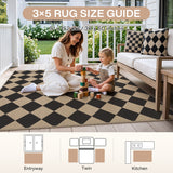 Black and beige checkered jute rug, 91 x 152 cm, on wooden porch with woman and child playing