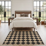 Black and beige checkered diamond pattern jute area rug on light wood floor in bedroom