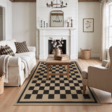 Black and beige checkered jute area rug on light wood floor in a living room