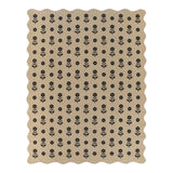 Black floral pattern on beige jute rug with scalloped edges, shown flat