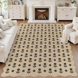 Black floral pattern on beige jute rug in a living room with white furniture