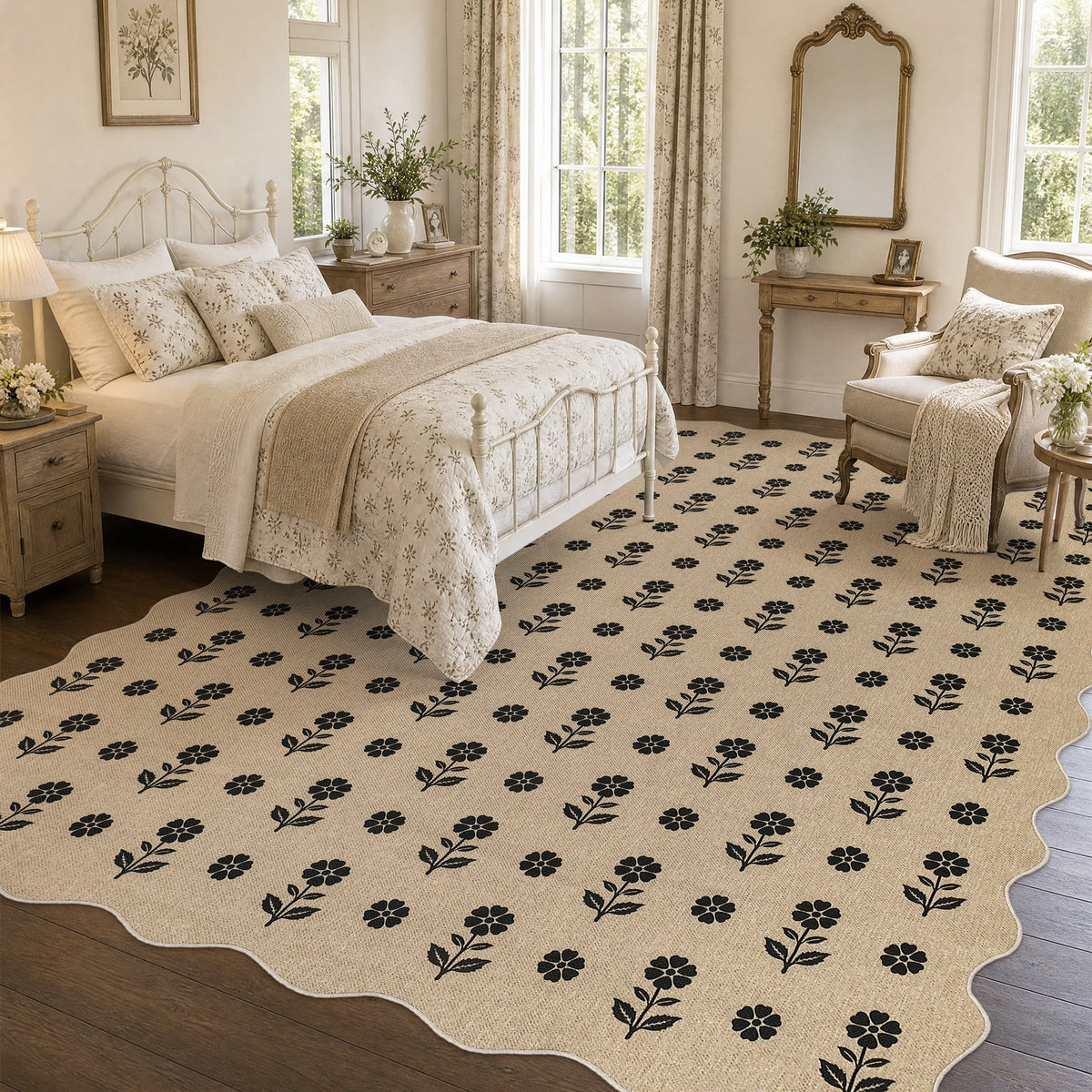 Beige jute rug with black floral pattern, scalloped edges, shown in bedroom on wooden floor