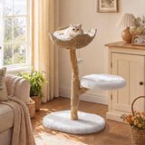 A white cat rests in a wicker basket atop a 35" tall solid wood cat tree with a fluffy white base, in a sunlit living room