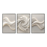 Three black-framed abstract canvas artworks with white 3D textured swirls and wave patterns