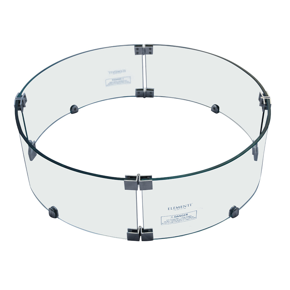 Clear tempered glass wind screen for outdoor fire pit, shown from top angle with black clips and 'ELEMENTI' label
