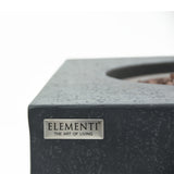 Close-up of dark grey fire pit table corner with 'ELEMENTI THE ART OF LIVING' label
