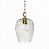Gold pendant light with hammered glass shade and adjustable chain, shown from front angle