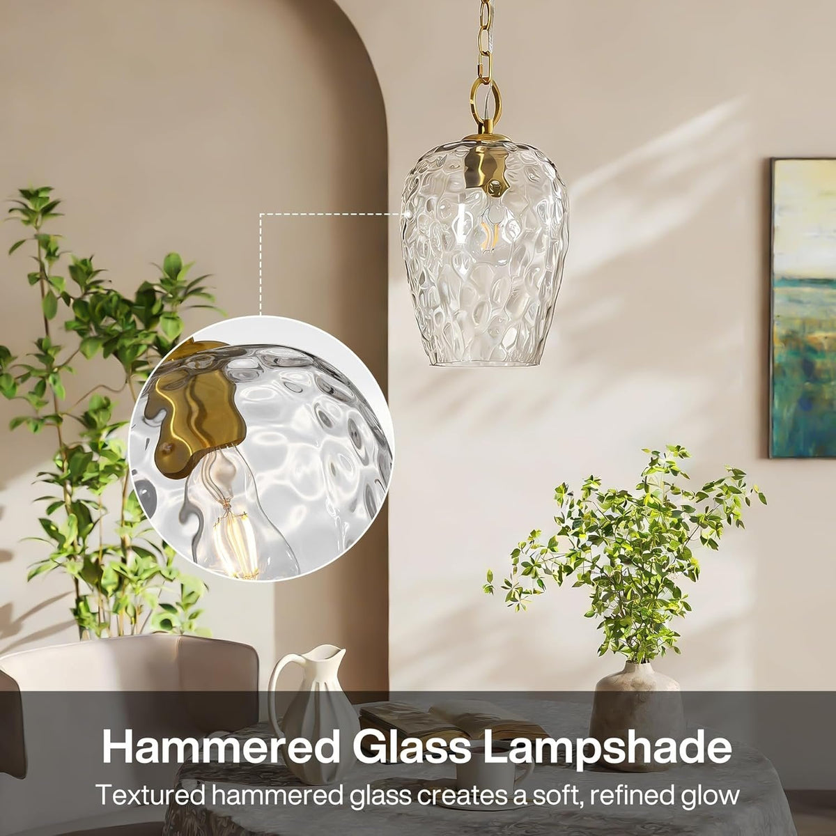 Gold hammered glass pendant light with adjustable chain, shown in a room with plants and artwork