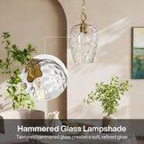 Gold hammered glass pendant light with adjustable chain, shown in a room with plants and artwork